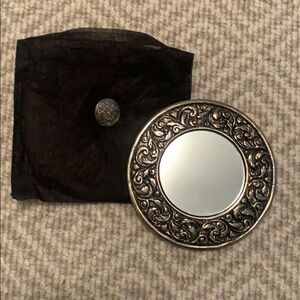 New silver compact mirror and bag